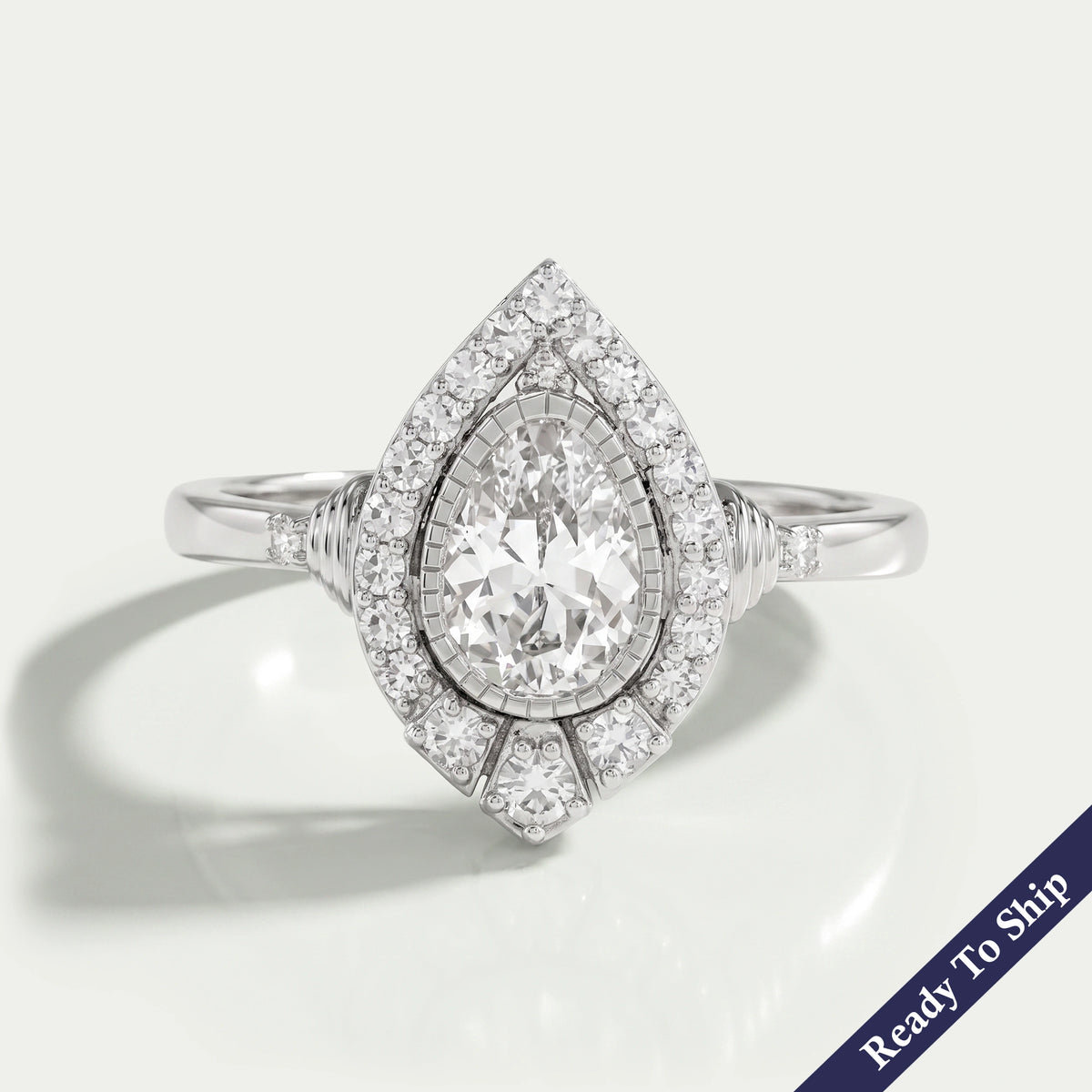Old Mine Pear Cut And Single Round Halo Engagement Ring