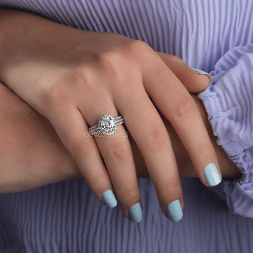 [On Finger view of old mine oval cut diamond halo engagement ring]-[Ouros Jewels]