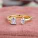 front view of emerald and marquise-cut lab diamond open cuff wedding band