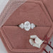 oval and trillion cut lab diamond five stone engagement ring in jewelry box