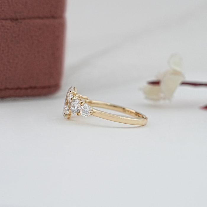 side view of oval and round cut lab diamond five stone engagement ring