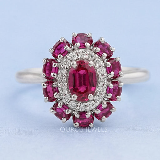 front view of round and red oval diamond engagement ring with double halo accent