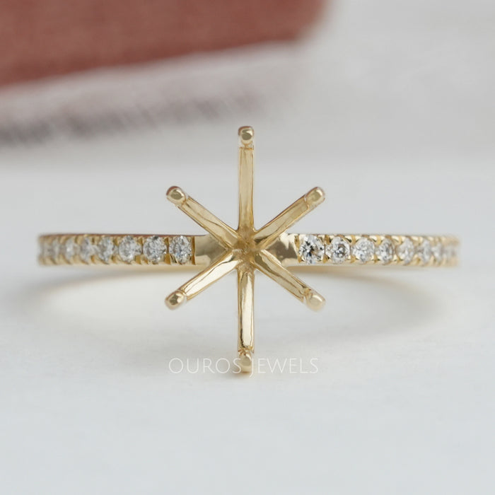 front view of oval-shaped semi-mount accent prong setting wedding ring