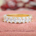 front view of oval cut diamond half eternity band shared prong setting