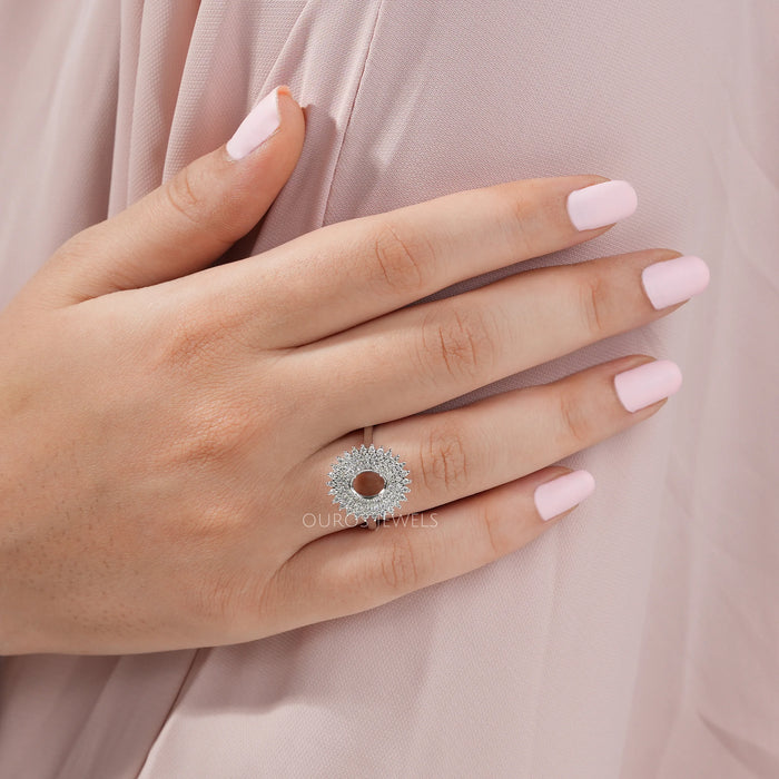 oval-cut semi-mount cluster lab diamond engagement ring on model's finger