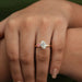 oval and pink heart-cut lab-grown diamond toi et moi engagement ring in finger
