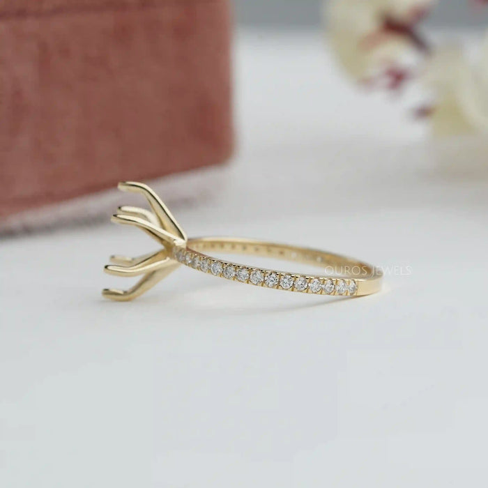 side view of oval-shaped semi-mount accent prong setting wedding ring