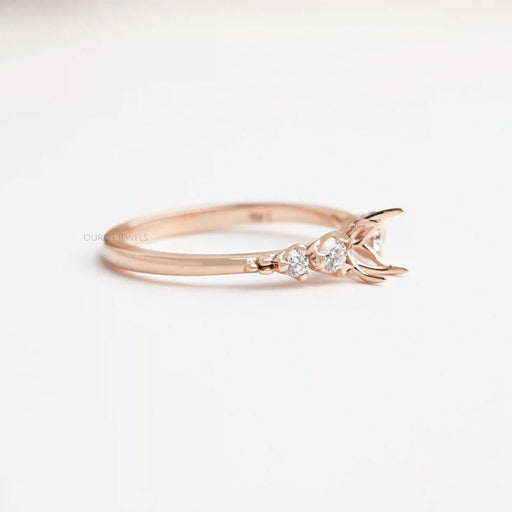 side view of floral semi mount round diamond side stones engagement ring rose gold