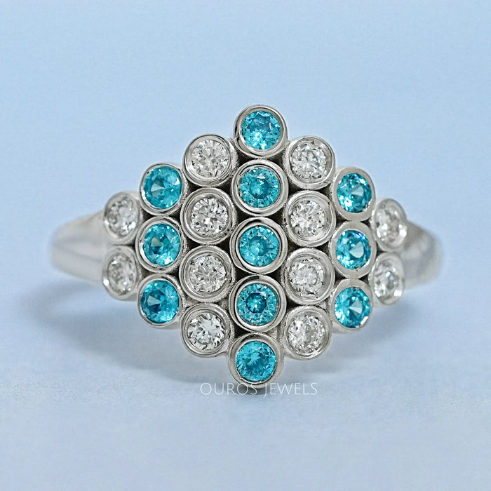 front view of round cut paraiba gemstone bezel set engagement ring