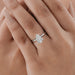 pear cut lab diamond solitaire engagement ring on model's hand