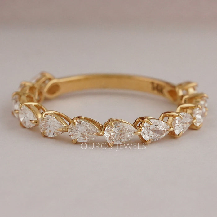 front view of pear cut lab grown diamond half eternity wedding band yellow gold