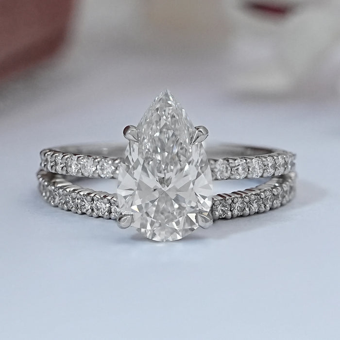 front view of pear-cut diamond solitaire bridal ring set with white gold band