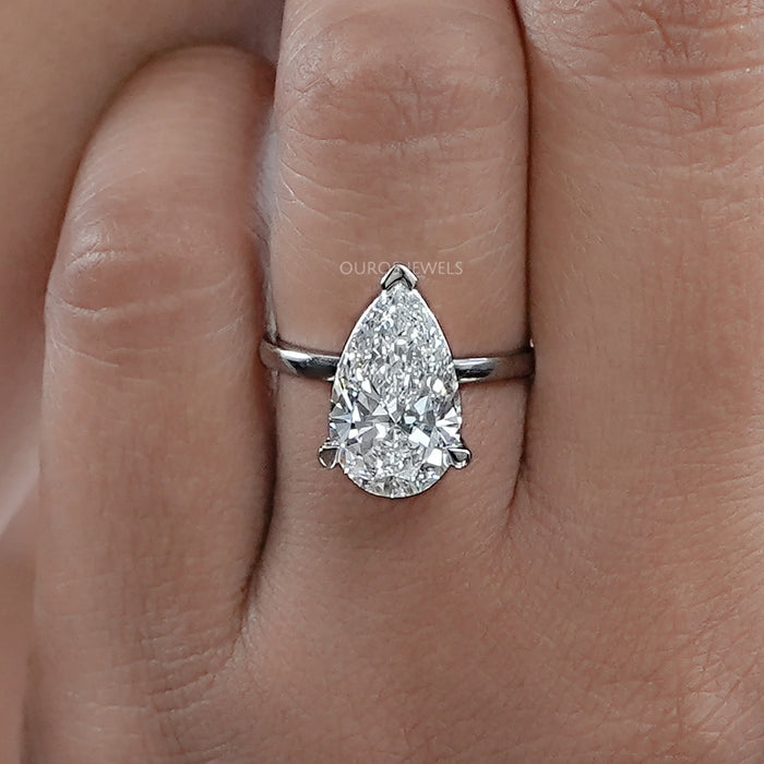 front angle view of pear cut lab diamond solitaire engagement ring