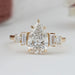 front view of pear and baguette cut lab diamond five stone engagement ring