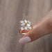 side view of pear-cut lab diamond leaf design cluster engagement ring