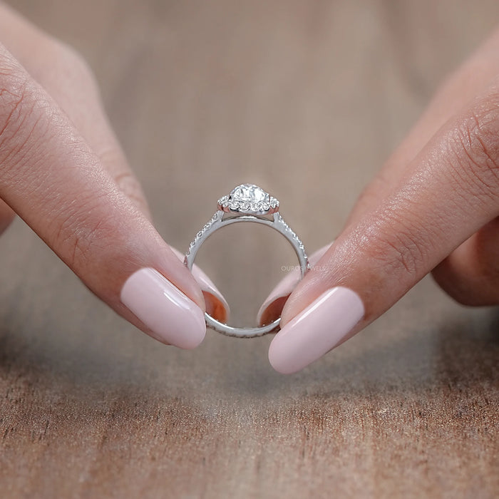 close view of pear cut lab diamond halo eternity wedding ring