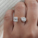 front view of pear and emerald-cut lab diamond halo toi et moi engagement ring
