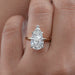 front view of pear shape diamond solitaire 5 prong engagement ring in finger