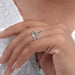 baguette and pear cut diamond spiral colored engagement ring on model&#39;s finger