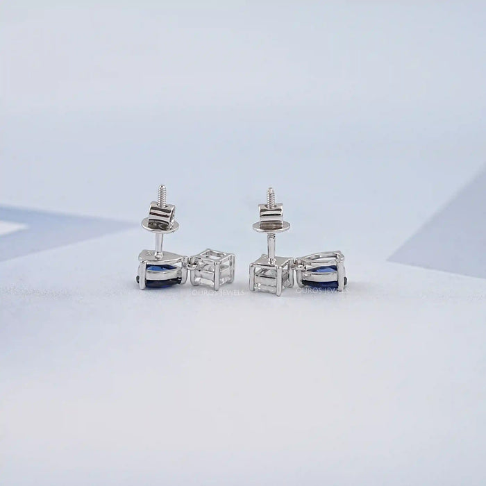 Boucles d'oreilles à deux pierres en saphir poire et diamant princesse