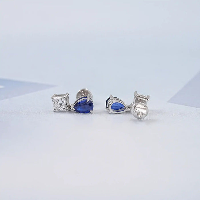 Boucles d'oreilles à deux pierres en saphir poire et diamant princesse