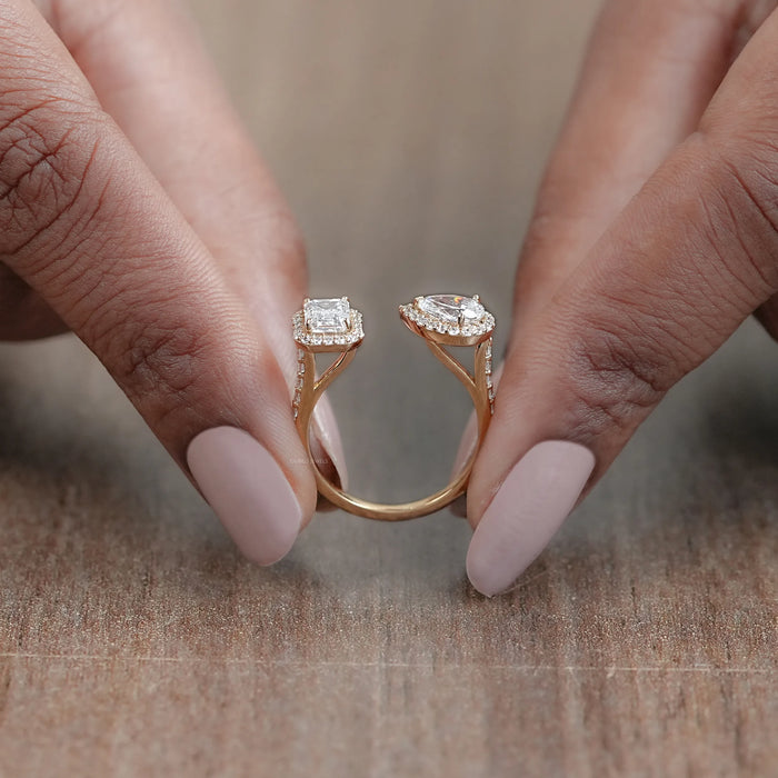 close view of pear and emerald-cut lab diamond halo toi et moi engagement ring
