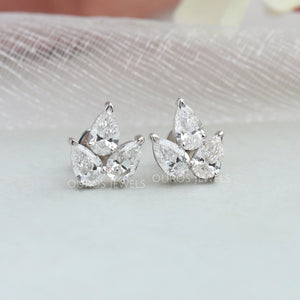 Boucles d'oreilles à trois pierres avec diamants taille poire