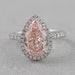 top view of pink pear cut diamond halo anniversary ring