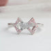 front view of round-cut lab-grown diamond classic wear bow ring pink on fabric