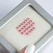 pink round shaped lab grown loose diamonds on box