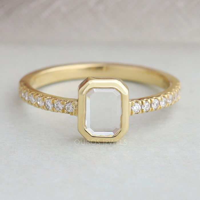 front view of portrait emerald cut diamond bezel set solitaire engagement ring