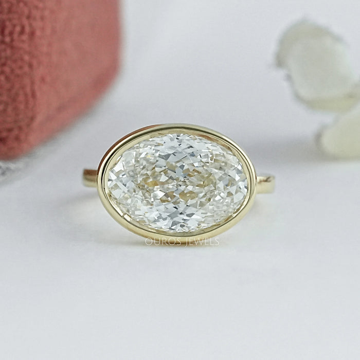 East West Portuguese Oval Bezel Set Engagement Ring