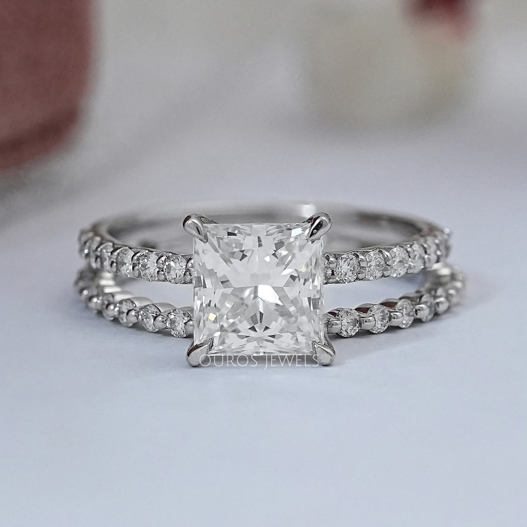 front view of princess-cut diamond solitaire bridal ring set with white gold band