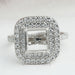front view of princess-cut semi-mount double halo engagement ring on fabric