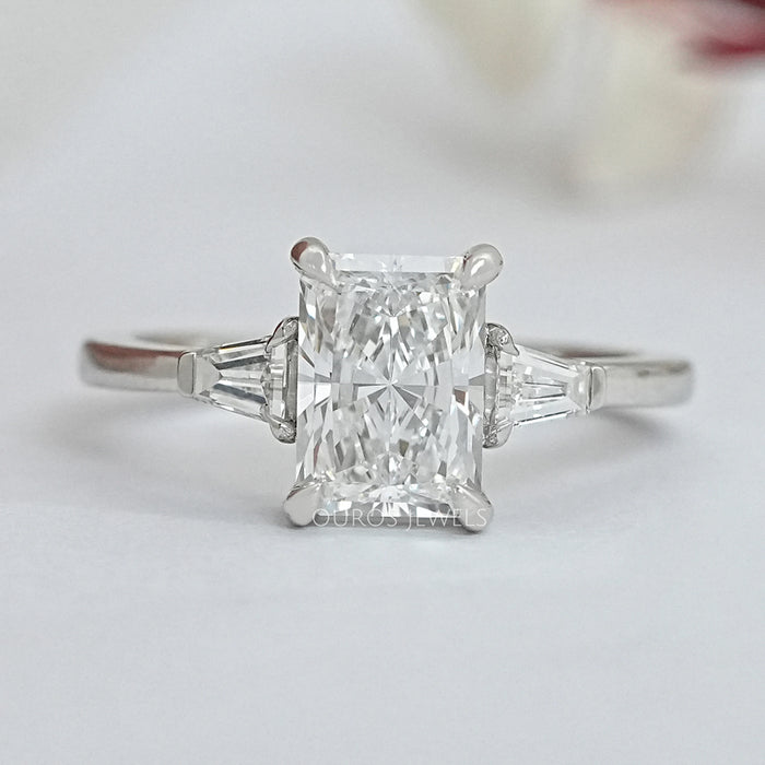brilliant radiant cut and tapered baguette three stone wedding ring's front view