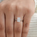 radiant cut diamond solitaire engagement ring in finger