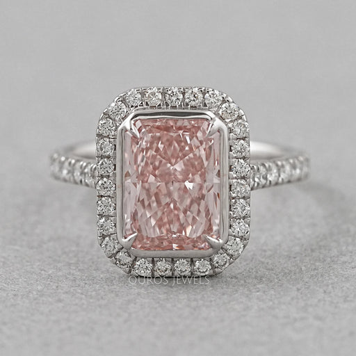 top view of fancy pink radiant cut diamond halo engagement ring