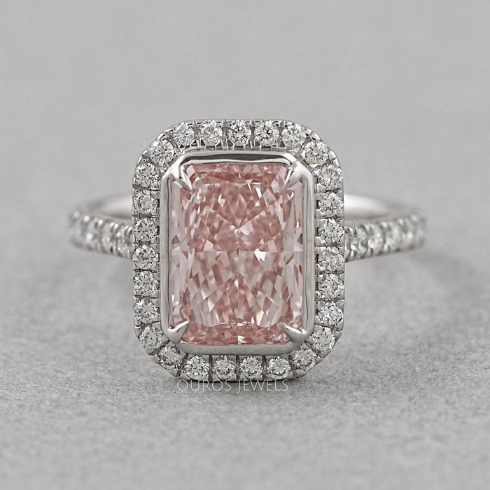 top view of fancy pink radiant cut diamond halo engagement ring