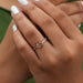 east-west rose-cut oval diamond solitaire engagement ring on model's finger