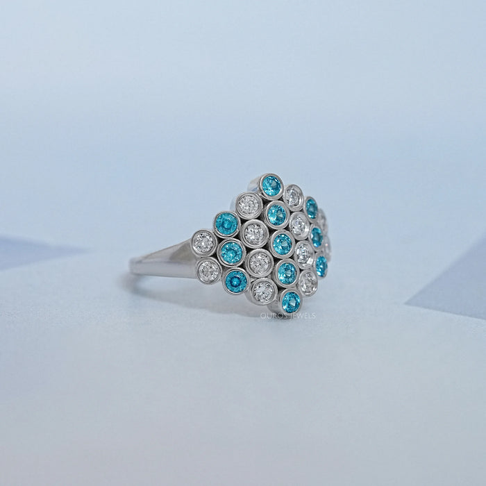 side view of round cut paraiba gemstone bezel set engagement ring