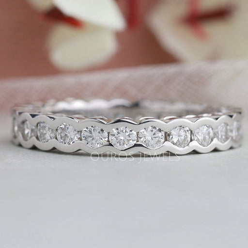 front view of round lab grown diamond half bezel set wedding band white gold