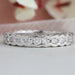front view of round lab grown diamond half bezel set wedding band white gold