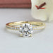 front view of round cut lab diamond solitaire hidden halo engagement ring yellow gold band