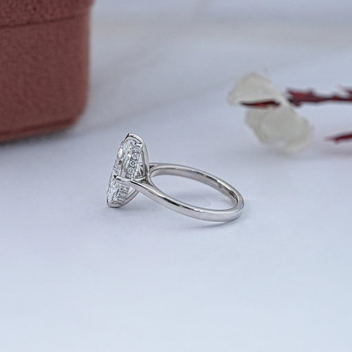 side view of 3 carat oval cut diamond hidden halo solitaire engagement ring