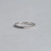 left view of black round-cut diamond channel-set half eternity band engagement ring