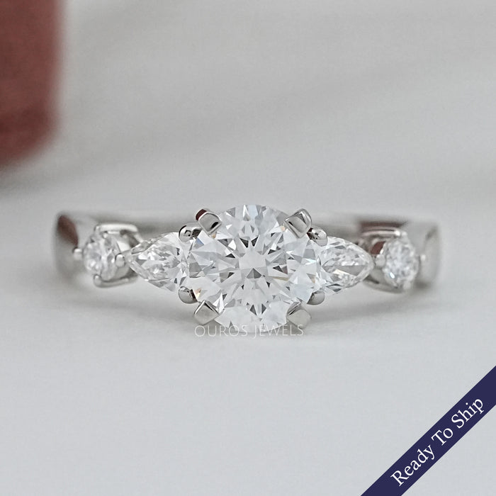 front view of round and pear cut lab diamond five stone engagement ring