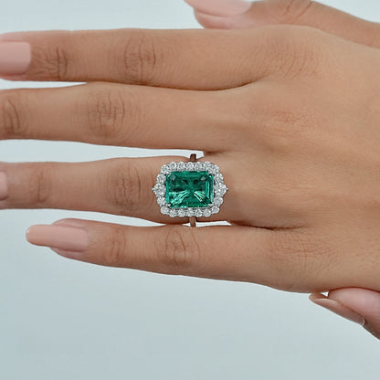 Bague de fiançailles Halo avec accent de diamant et émeraude verte