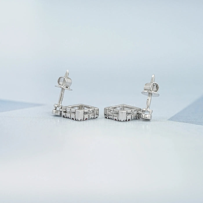 Boucles d'oreilles pendantes avec pierres précieuses en rubis rondes serties de lunette