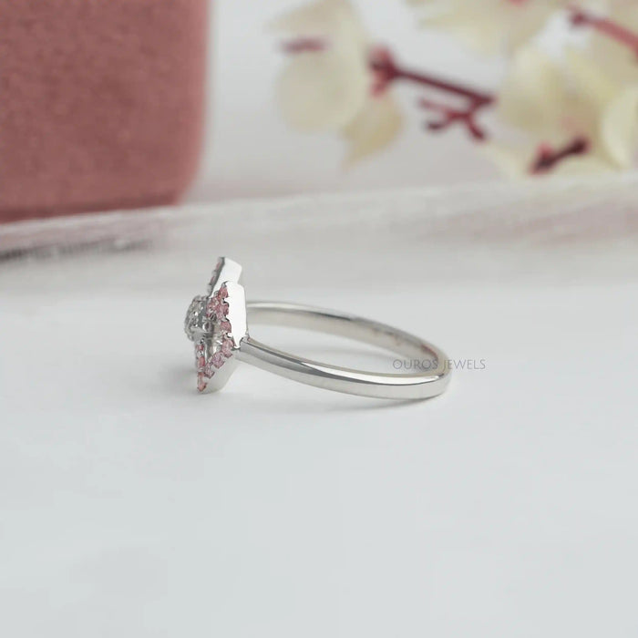 side view of round-cut lab-grown diamond classic wear bow ring pink on fabric