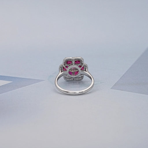 back view of red ruby cushion cut & round diamond floral halo engagement ring